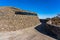 Modern Public Architecture. Curved Inclined Wall Made from Stone.