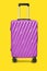 Modern purple suitcases bag on yellow background with clipping path on luggage object