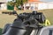 Modern quad bike in field near house on sunny day, closeup