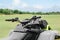 Modern quad bike on green grass in field, closeup