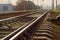 Modern railroad tracks with the railroad switch on foreground