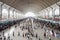 modern railway station, with passengers and officials in hustle and bustle