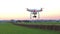 Modern RC UAV Drone / Quadcopter with camera flying on a clear s