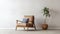 Modern Recliner Chair With Potted Plant In Front Of White Wall