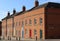 Modern red brick terraced houses, colorful doors