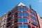 Modern red building against blue sky