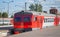 Modern red suburban electric train