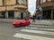 Modern red Velomobile Mango Sport with driver