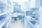 Modern research facility room out of focus. This blurred image toned blue