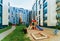 Modern residential apartment flat house building and children playground