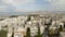 A modern residential area of the Greek city of Athens on the seafront surrounded by mountains. Top view of the roofs of