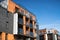 Modern residential buildings with glass balconies.