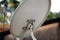 Modern residential satellite dish antenna view with selective focus under daylight.