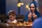 In a modern restaurant setting, a European Islamic family comes together for iftar during Ramadan, engaging in prayer