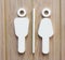 Modern restroom sign male and female on wooden