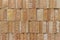 Modern rough textured limestone wall background with vertical aligned stone bricks