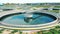 Modern round wastewater cleaning reservoirs at a sewage treatment facility