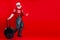 Modern Santa Claus isolated on red background. Merry Christmas and Happy New Year concept