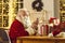 Modern Santa Claus text messaging and ordering presents delivery using phone app