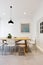 Modern scandinavian styled interior dining room with pendant light