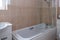 Modern Scottish Household Bathroom with Shower over Bath