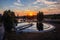 Modern sewage treatment plant. Wastewater purification tanks at sunset, aerial view