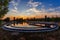 Modern sewage treatment plant. Wastewater purification tanks at sunset, aerial view