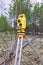 Modern shabby electronic total station mounted on tripod