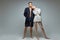 Modern shoot of slim couple in big jacket and sweater on naked body
