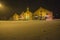 Modern shops in old brick buildings (at night and in the blizzard)