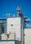 Modern silos for storing grain harvest at the blue sky background.