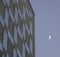 Modern skyscraper with crescent moon