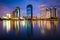 Modern skyscrapers and Lake Rajada at night, at Benjakiti Park,