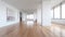 Modern, sleek apartment with clean white walls and beautiful hardwood floors.