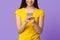 Modern Smartphone In Hands Of Unrecognizable Asian Girl Standing On Purple Background