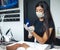 Modern spa and beauty studio and cosmetic salon. Asian woman on protective mask and rubber gloves, work with hands of