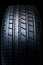 Modern sport tyre. Clean Tyre. Black new shiny car tire background.