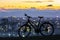 Modern sports city bicycle standing alone over night city background