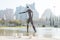 Modern statue of waterman with trident in pond at Turia River Park, Valencia, Spain