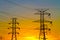 Modern Steel Electrical Towers at Sunset