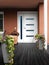 Modern stone house entrance white door