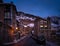 Modern stone houses and apartments in El Tarter village at night in Pyrenees, Andorra