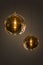 Modern streamlined mirror round copper chandelier. Bubble glass transparent pendant light. Isolate on dark background