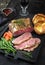 Modern style Commonwealth Sunday roast with sliced cold cuts roast beef with vegetable and Yorkshire pudding