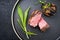 Modern style Italian barbecue dry aged sliced fillet steak with wild garlic and pioppinos on a design plate