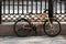 Modern style mountain bicycle locked by the fence in city street in the city