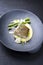 Modern style traditional fried skrei cod fish filet with green asparagus tips and mashed potato creme in parmesan olive oil sauce