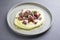 Modern style traditional Italian polpo alla griglia su crema di patate with barbecued octopus, potato creme and tomatoes