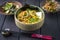 Modern style traditional Japanese vegetarian ramen soup with corn and tofu in a design  bowl