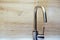 Modern styled kitchen faucet for water. Matte chrome finish